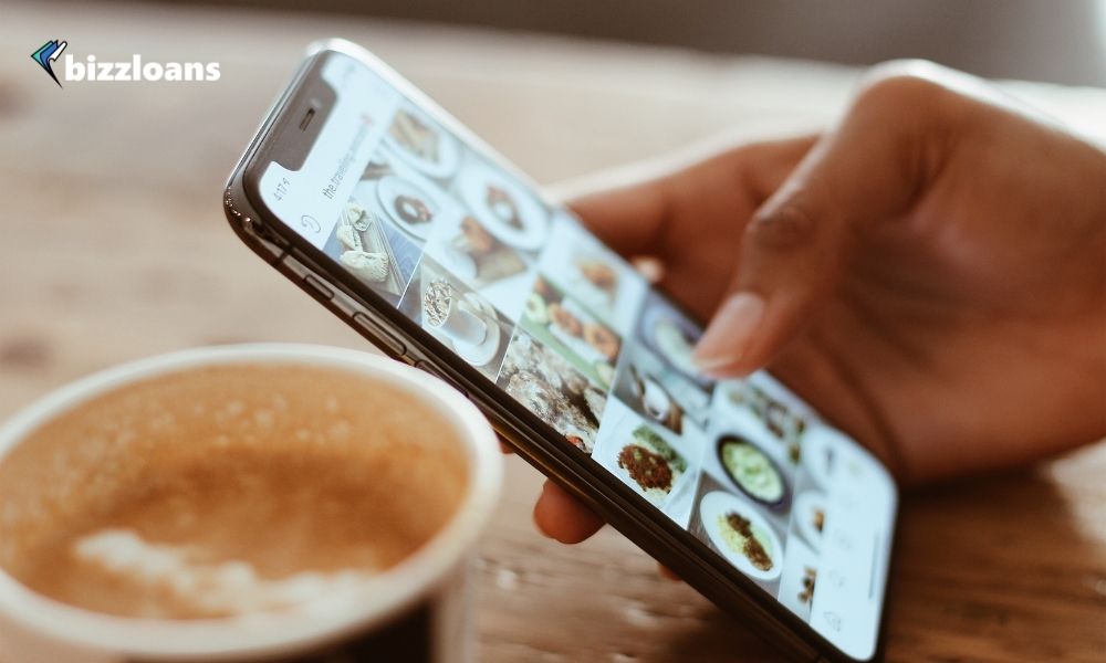 man using his phone to promote his brand in social media 