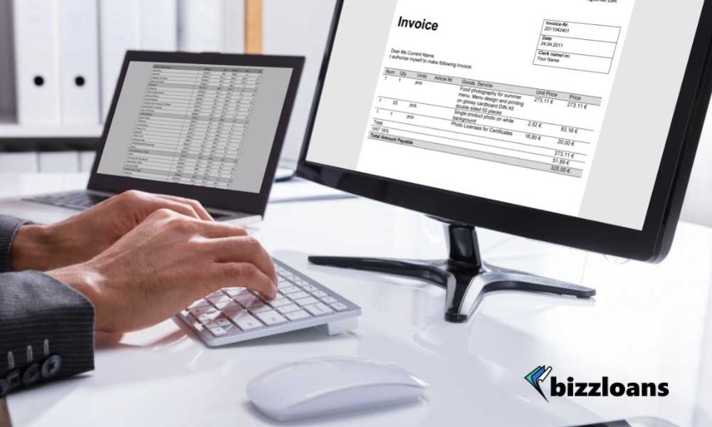 business person checking invoice on computer