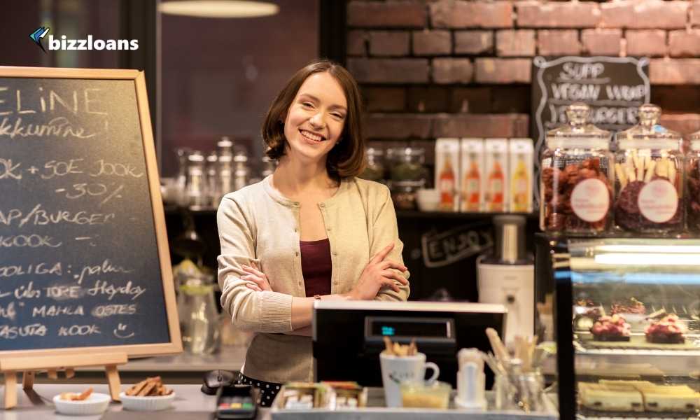 happy business owner at the cafe counter