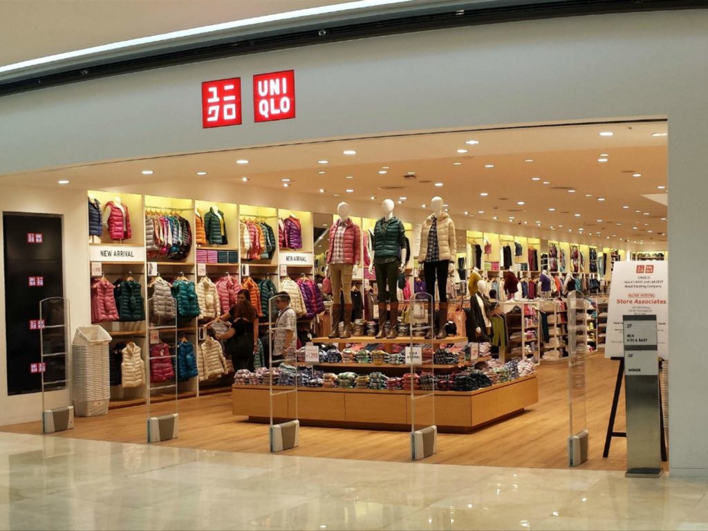 Uniqlo store in Sydney, Australia with 3 people shopping around