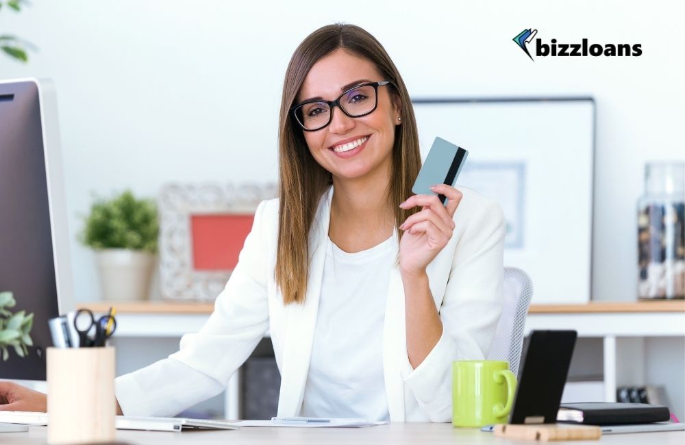 Young business owner using a credit card for her business needs