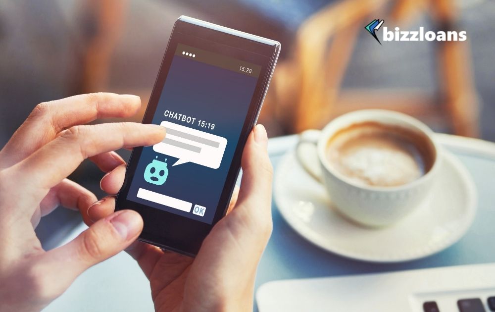 hand of a business owner using his cellphone with chatbot answering questions online 