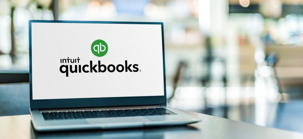 laptop displaying the logo of Quickbooks