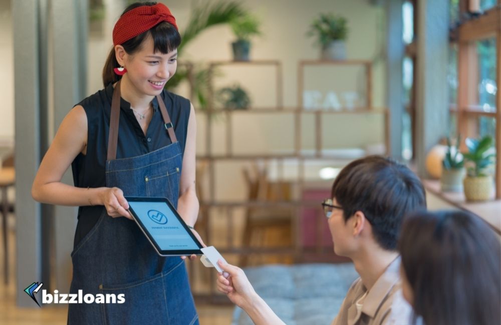 Customer paying using contactless payment option in a cafe