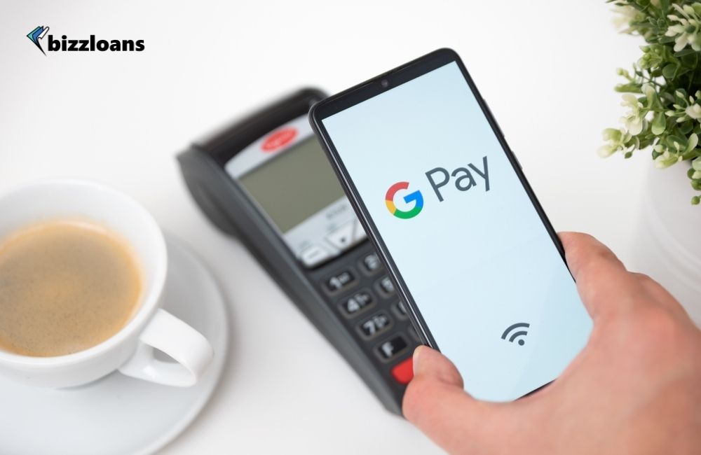 Man holding smartphone with Google Pay logo which is one of the best mobile payment app
