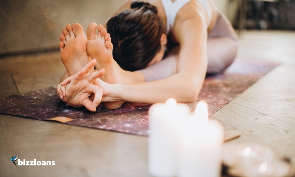 business owner doing yoga as one of the mental health tips