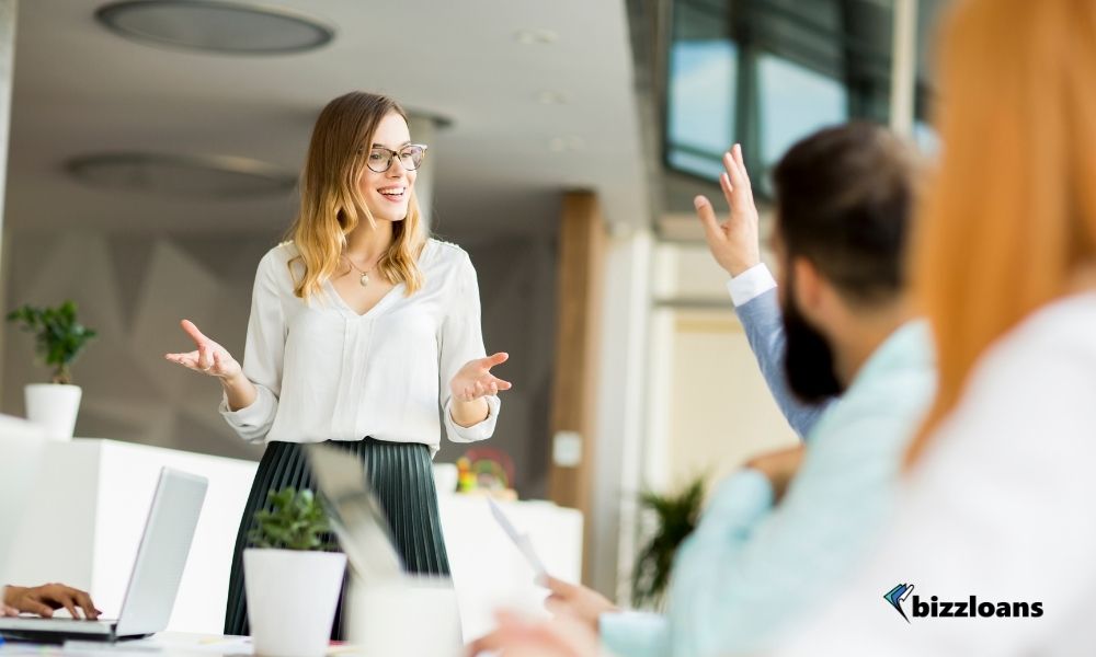 young woman presenting in a business meeting