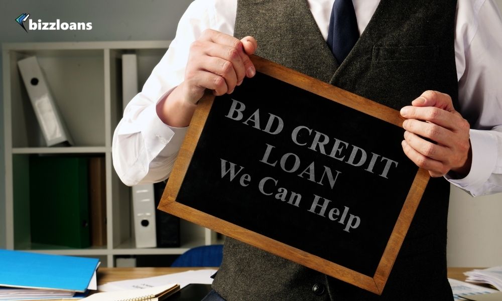 Man with sign Bad Credit Loan We can help.