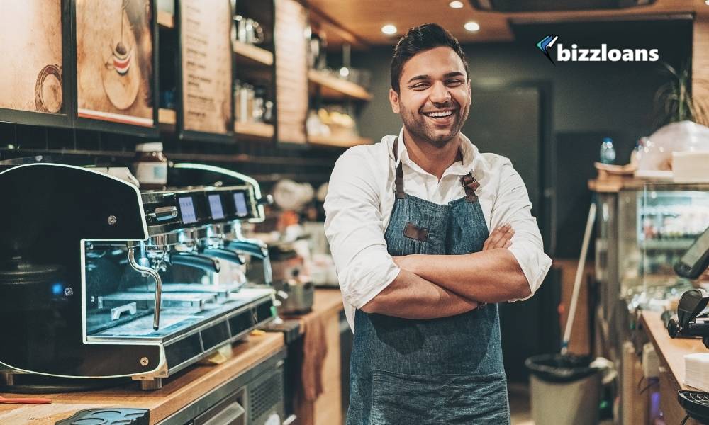 happy small business owner in coffee shop counter