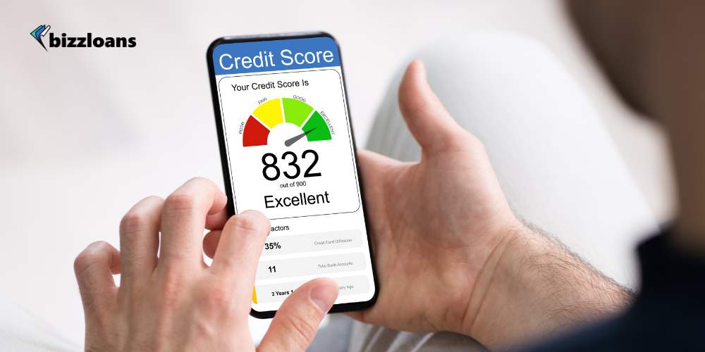 business man checking credit score on mobile; excellent score of 832