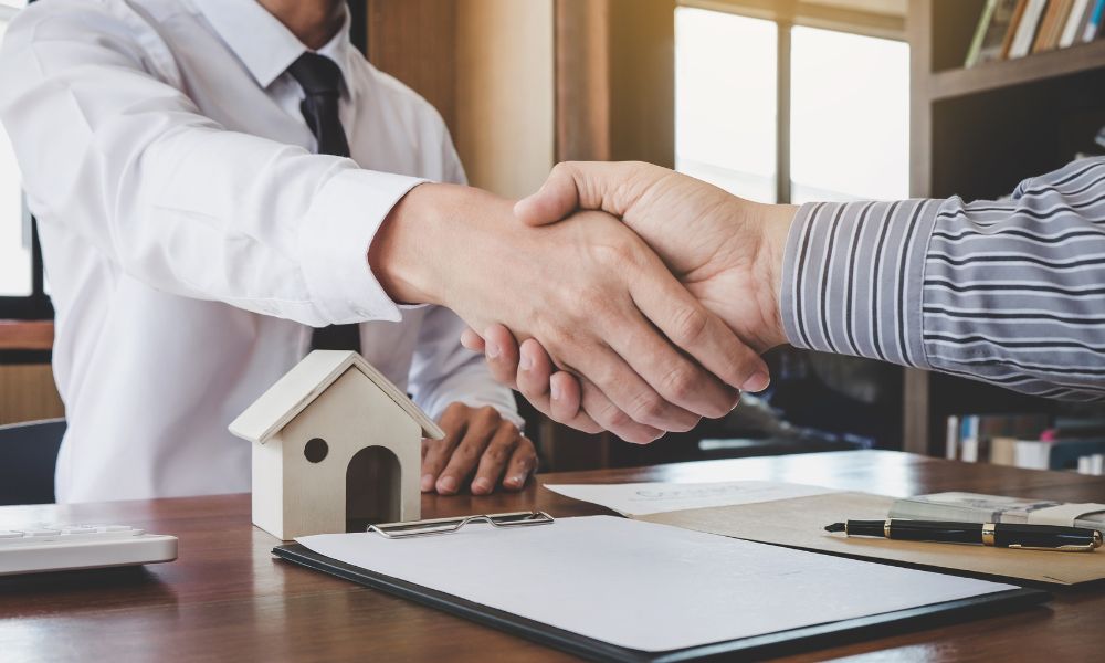 business owner shaking hands with lender