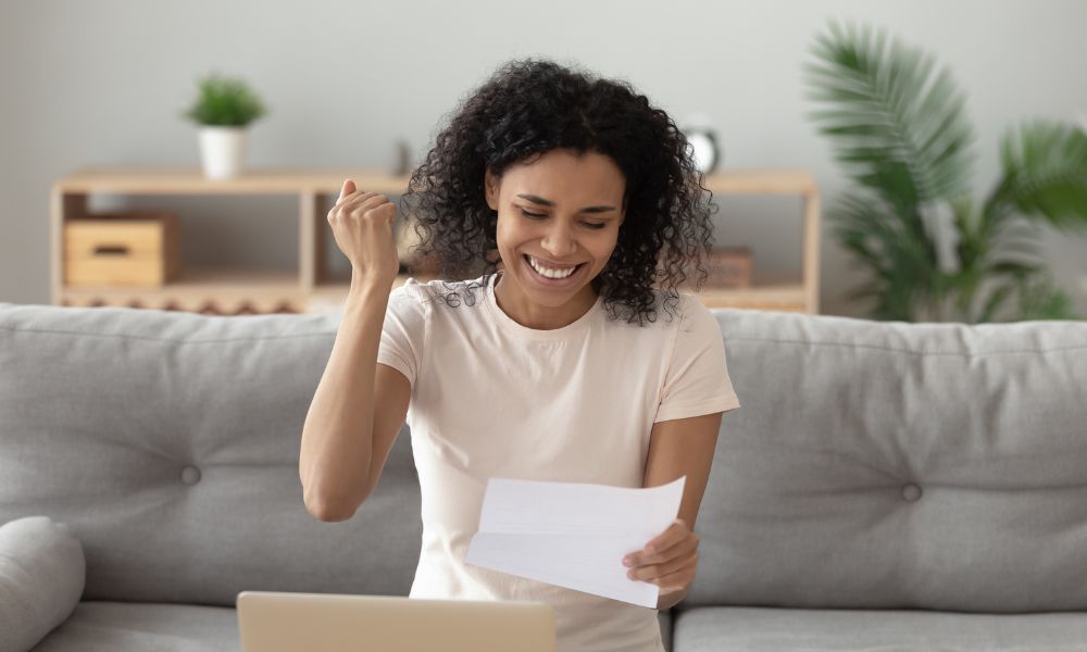 happy woman to receive a business loan approval